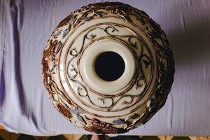 青花釉里红镂雕狮子穿花卉纹大梅瓶